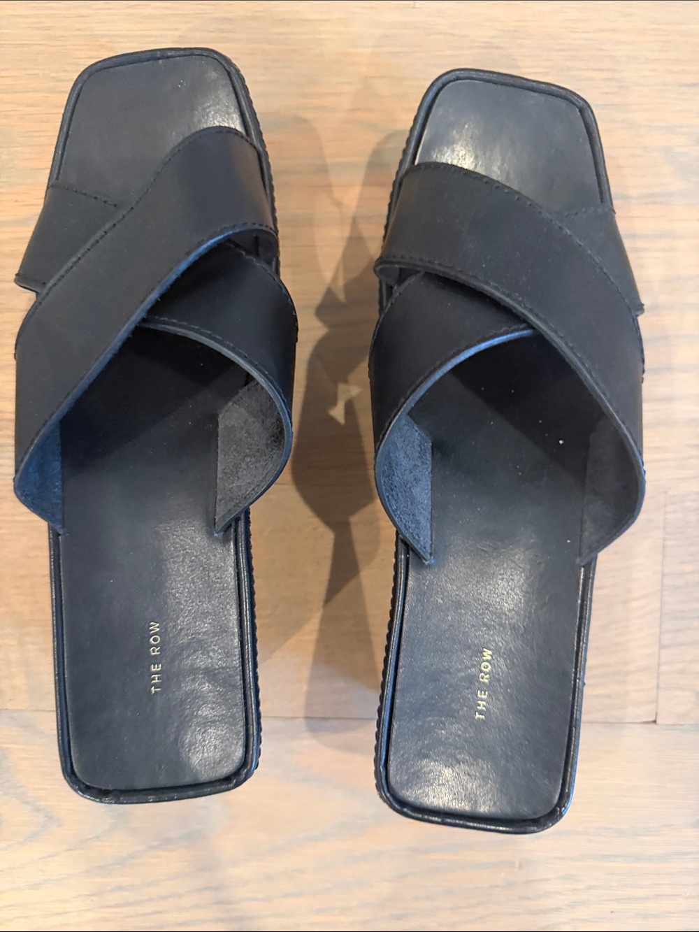 The Row Black Leather Crisscross Slide Mules